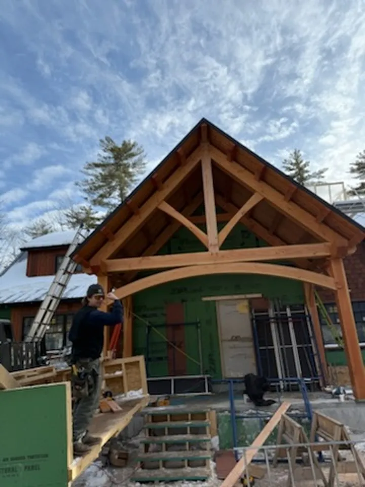 Wood archway and dormer detail on a custom home