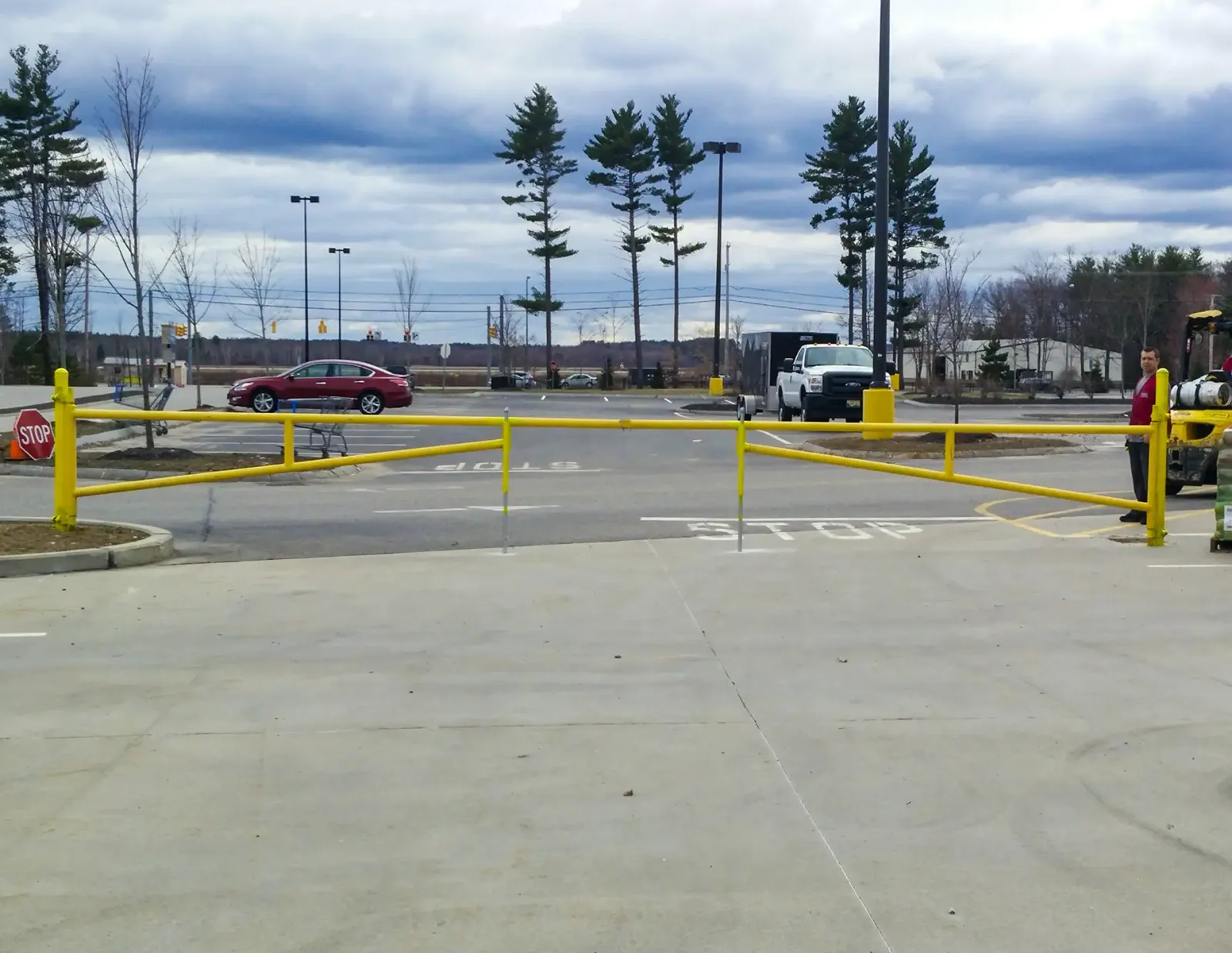 Olympic Fence Co. installing a commercial chain-link fence and access control system near West Newbury, MA.