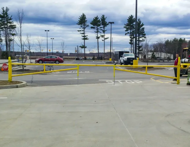 Olympic Fence Co. installing a commercial chain-link fence and access control system near West Newbury, MA.