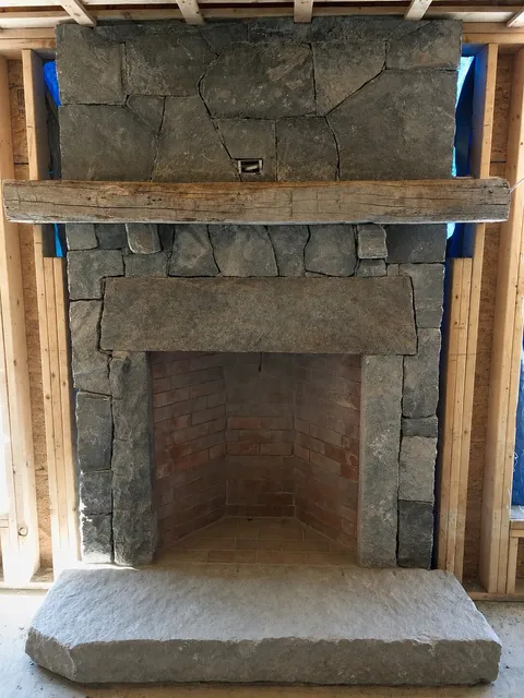 Stone Rumford fireplace and brick chimney in Medway Massachusetts