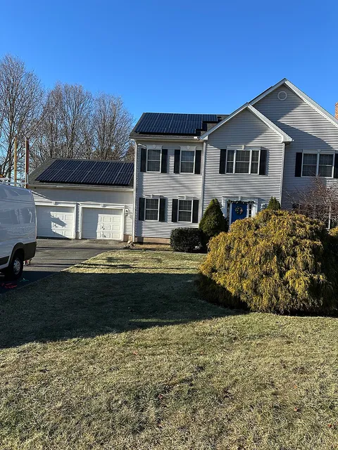 Solar panels on garage and home rooftop