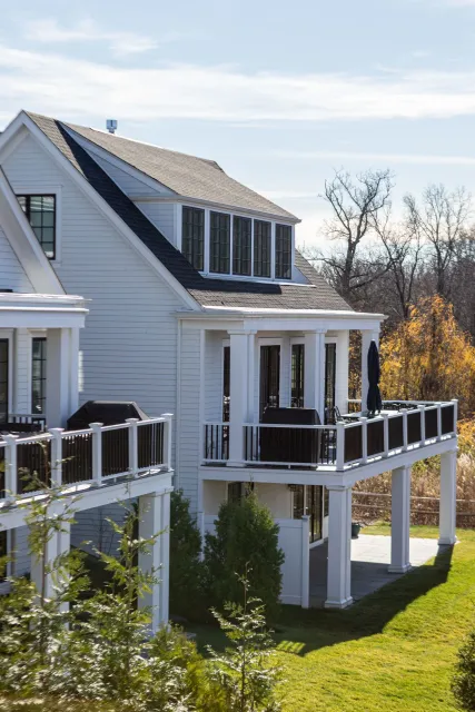A large white house with a lot of windows and balconies