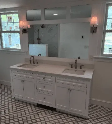 Custom vanity and mirror made by Flourish Property Services Boston, MA