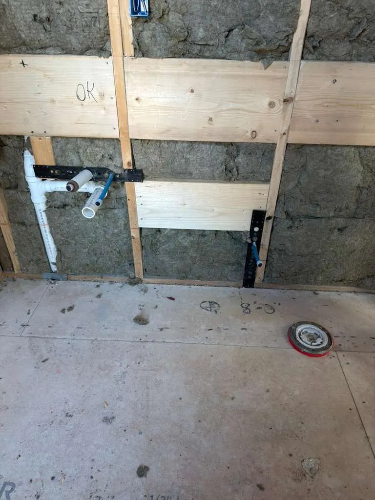 Bathroom rough plumbing for sink and toilet installation