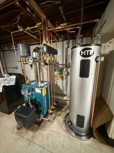 Oil Fired Boiler Change Out. Replaced oil fired boiler and electric water heater install (HTP). North Shore, Massachusetts. Boston. Plumbing.