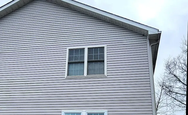 New vinyl siding installed on a Fairfield County, CT home, with finished trim and roofline
