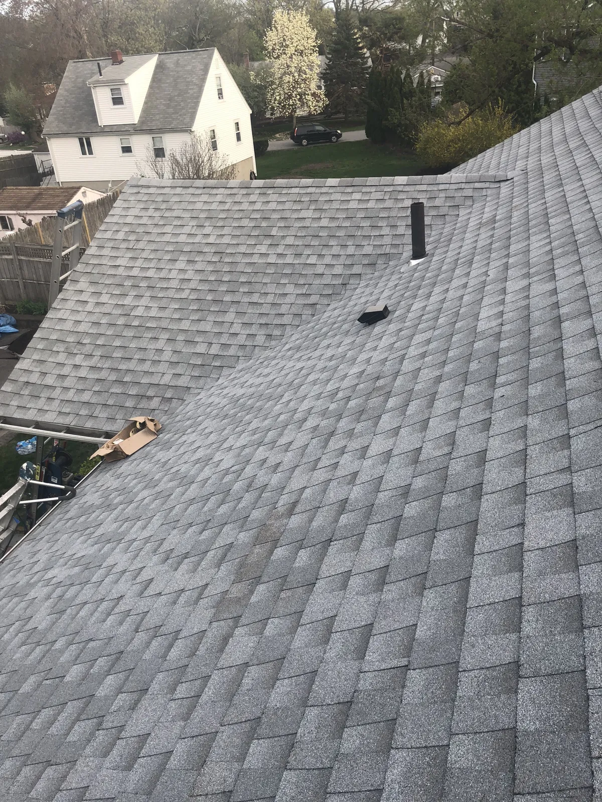 Completed gray architectural shingle roof installed by Storm King Roofing on a home in Waltham, MA