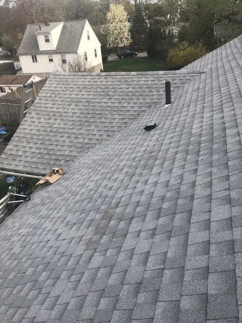 Completed gray architectural shingle roof installed by Storm King Roofing on a home in Waltham, MA