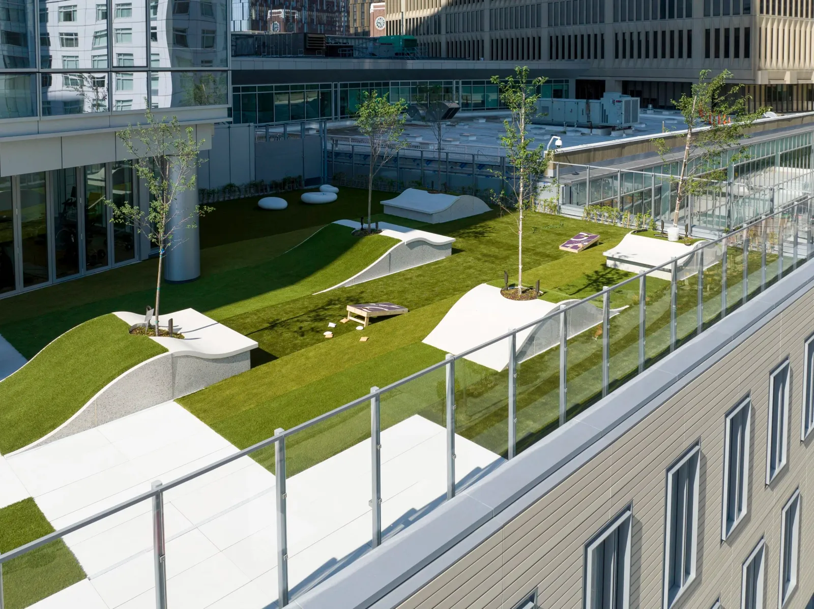 Expert commercial landscape development in New England. Example of a green roof with usable park space on a multi-story apartment building in Boston.