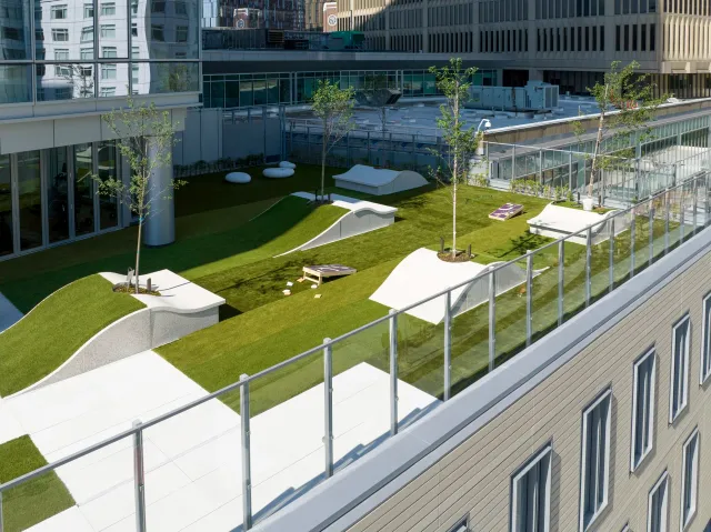 Expert commercial landscape development in New England. Example of a green roof with usable park space on a multi-story apartment building in Boston.