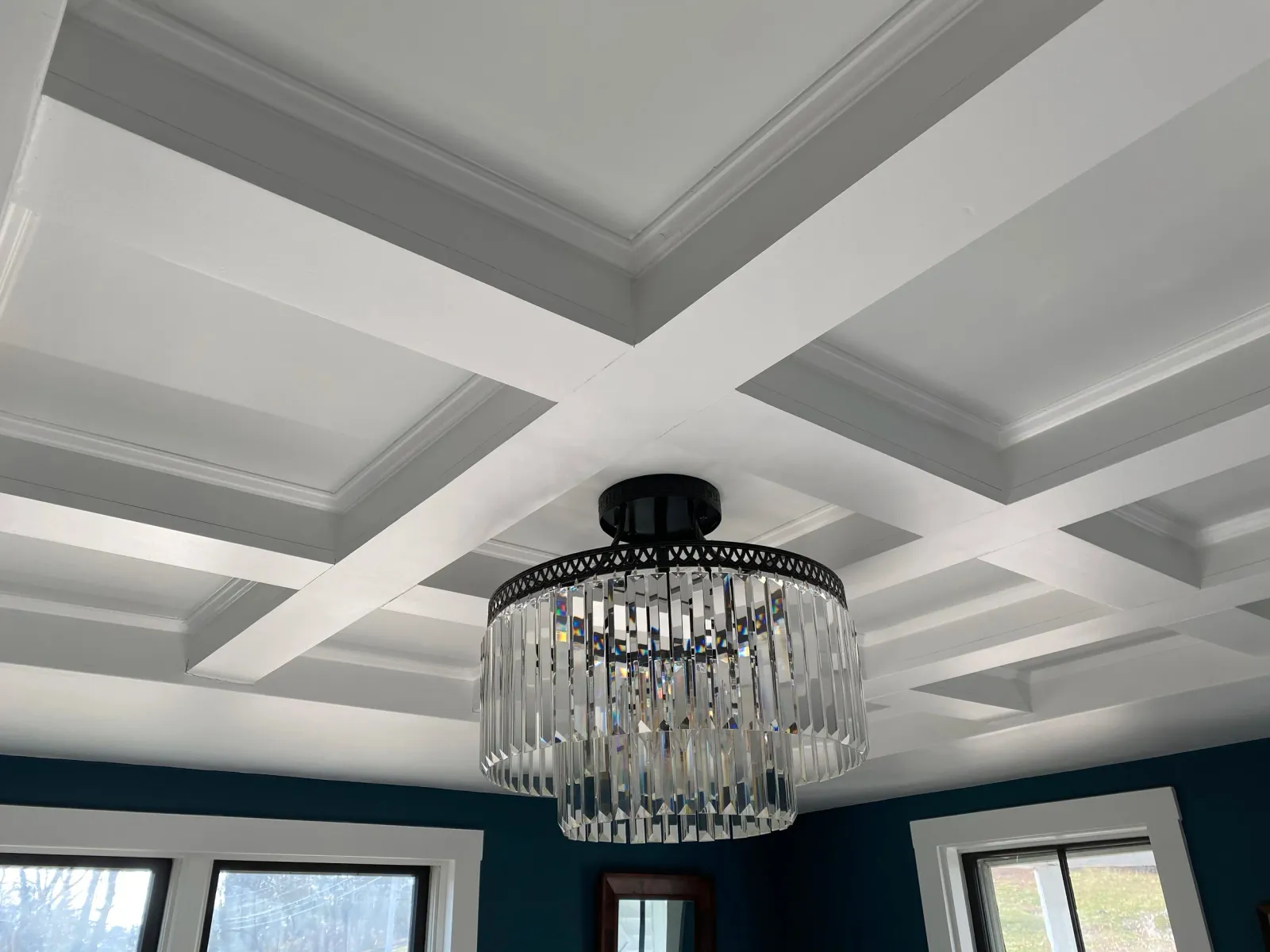 A coffered ceiling in a dining room, replacing dated drywall and recessed lighting