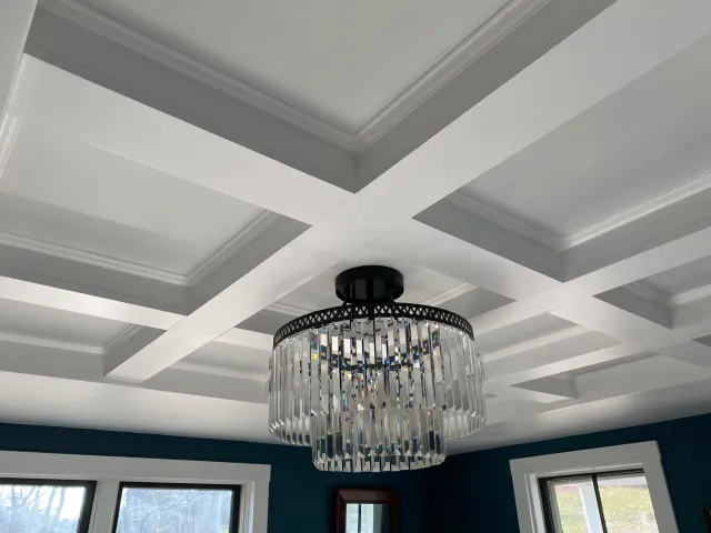 A coffered ceiling in a dining room, replacing dated drywall and recessed lighting
