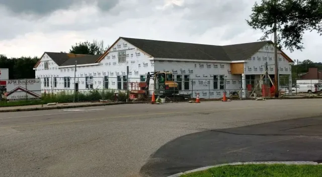A building is being built on the side of the road.