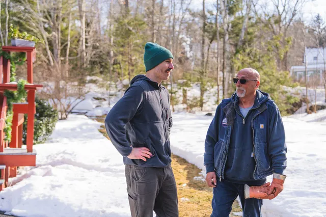 M.W. Sewall propane delivery driver Dan meeting with a local customer in Midcoast Maine.