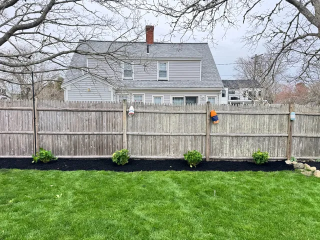 Newly planted shrubs in a freshly mulched garden bed