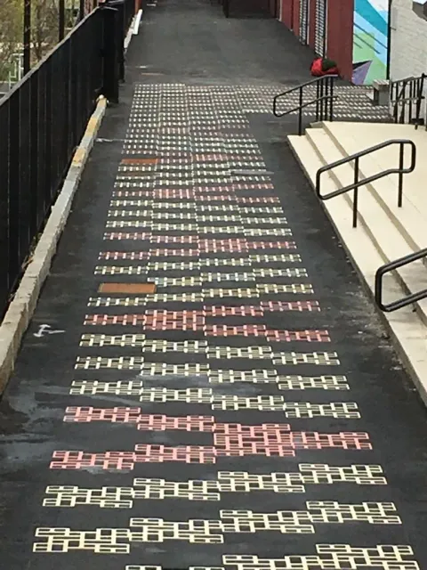 A chalk drawing on the side of a road