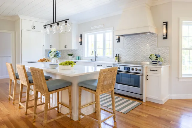 Kitchen remodeling project with white cabinetry and shiplap ceiling