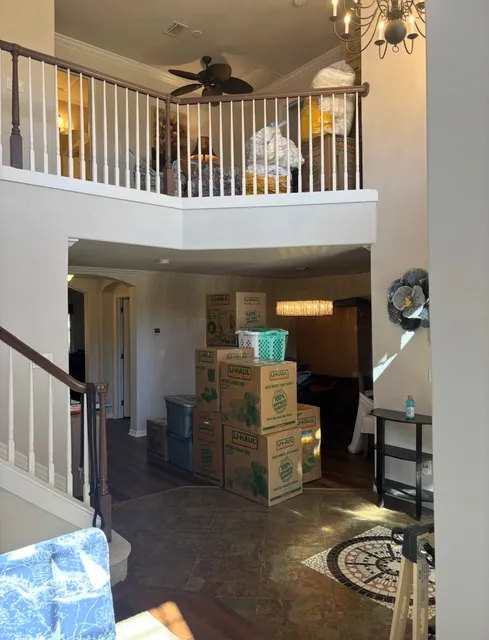 Packed and stretch-wrapped household goods staged for a New Hampshire to Florida move