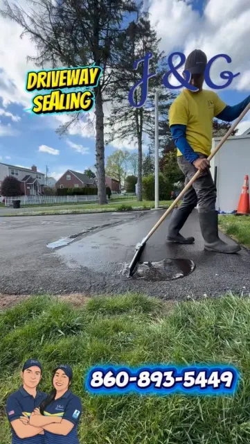 Worker sealing driveway with squeegee in wet pavement, “Driveway Sealing” text and phone number ad overlaid