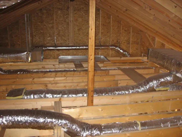 Insulated duct trunk and branch runs in a new attic
