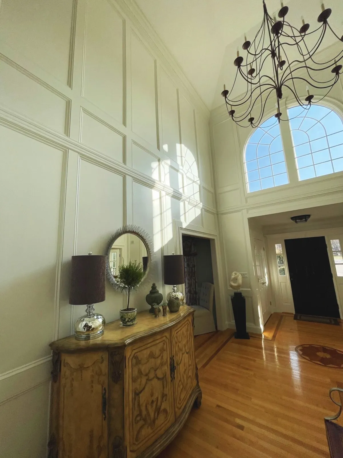 Wood panelling added to two story tall foyer