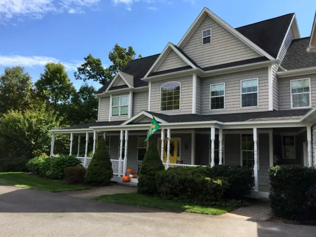 Front of home with stone driveway