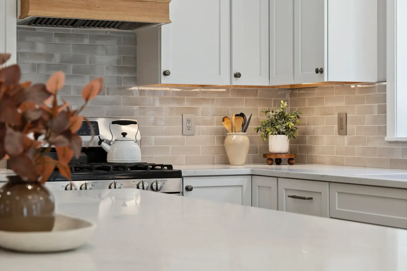 Kitchen remodel in Nashua, NH — white oak flooring and warm white paint palette