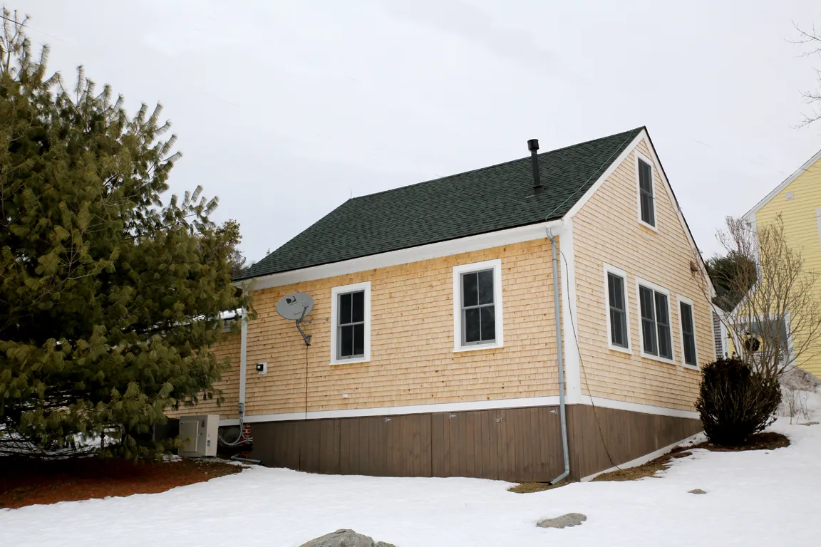 Exterior of a converted school house with new cedar shingles