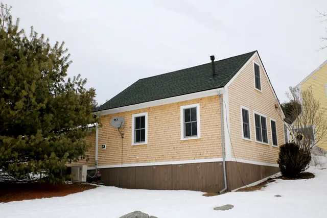 Exterior of a converted school house with new cedar shingles