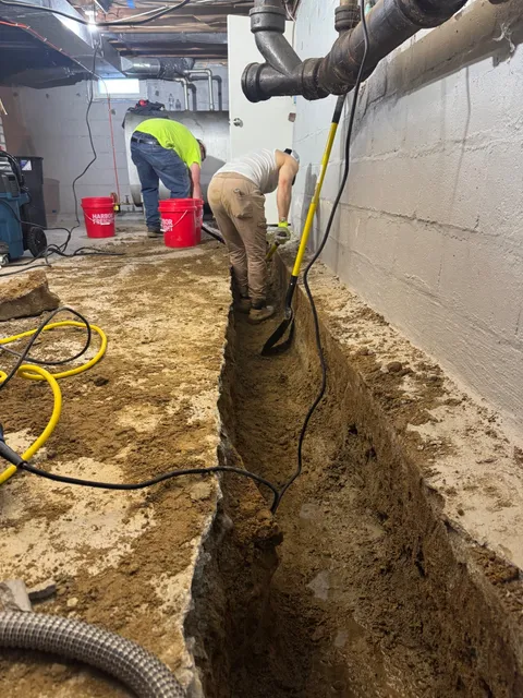 Basement perimeter trench excavated for a new drain system
