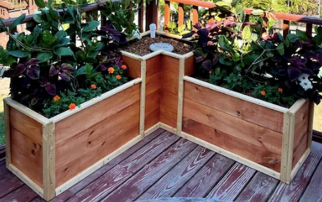 l-shaped custom self-watering planter on deck