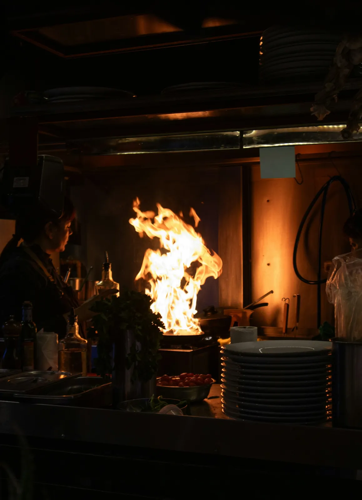 Active kitchen fire with flames near the stove before fire and smoke damage restoration in Hampden County, MA