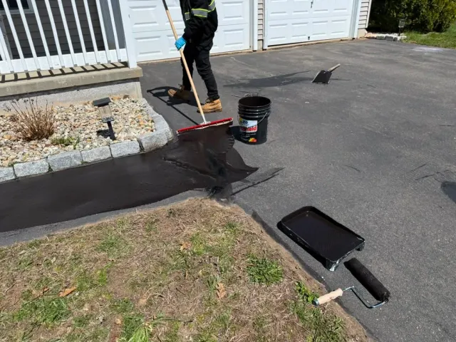 Preventive pavement maintenance inspection on a Massachusetts driveway