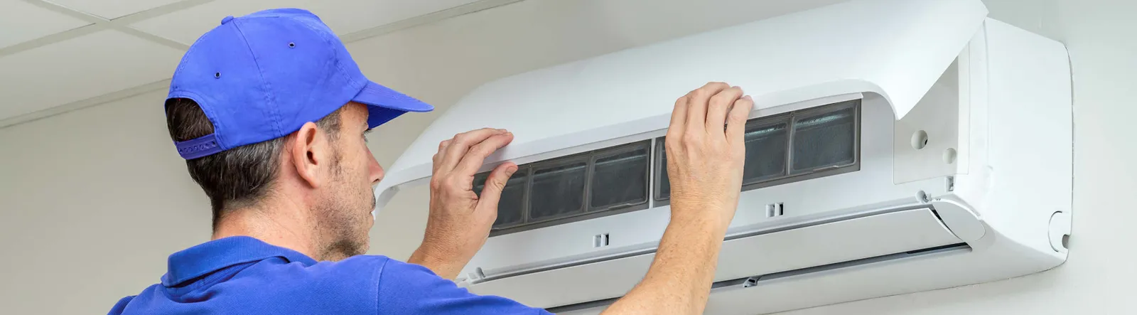 Technician repairing AC