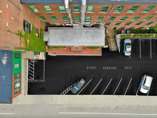 A parking lot with a lot of cars parked in it
