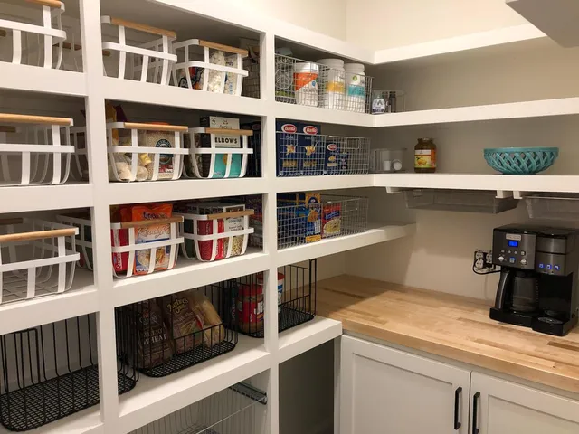 Interior shot of custom kitchen pantry shelving with organization and new countertops