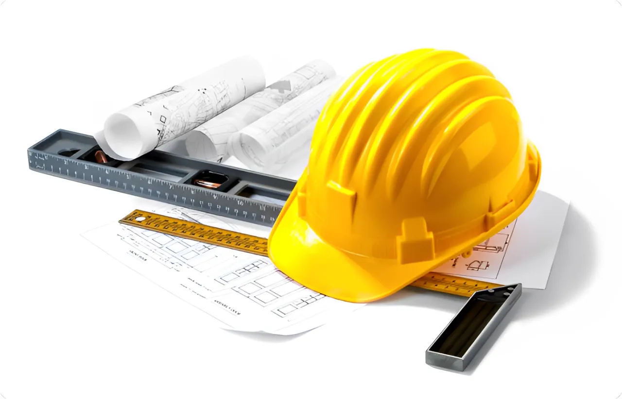 Yellow hard hat, blueprints, and tools.
