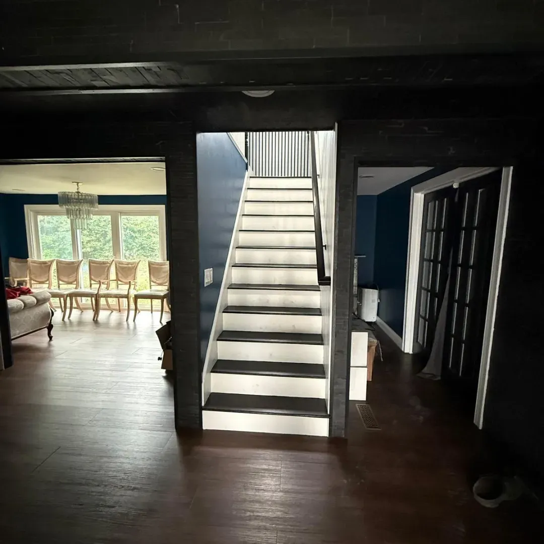 Interior staircase before renovation in Stoneham, MA — Tinbercraft Construction full home remodel