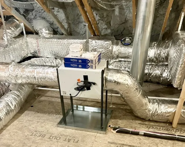 Aprilaire whole-home humidifier installed in attic with insulated ductwork in Connecticut home