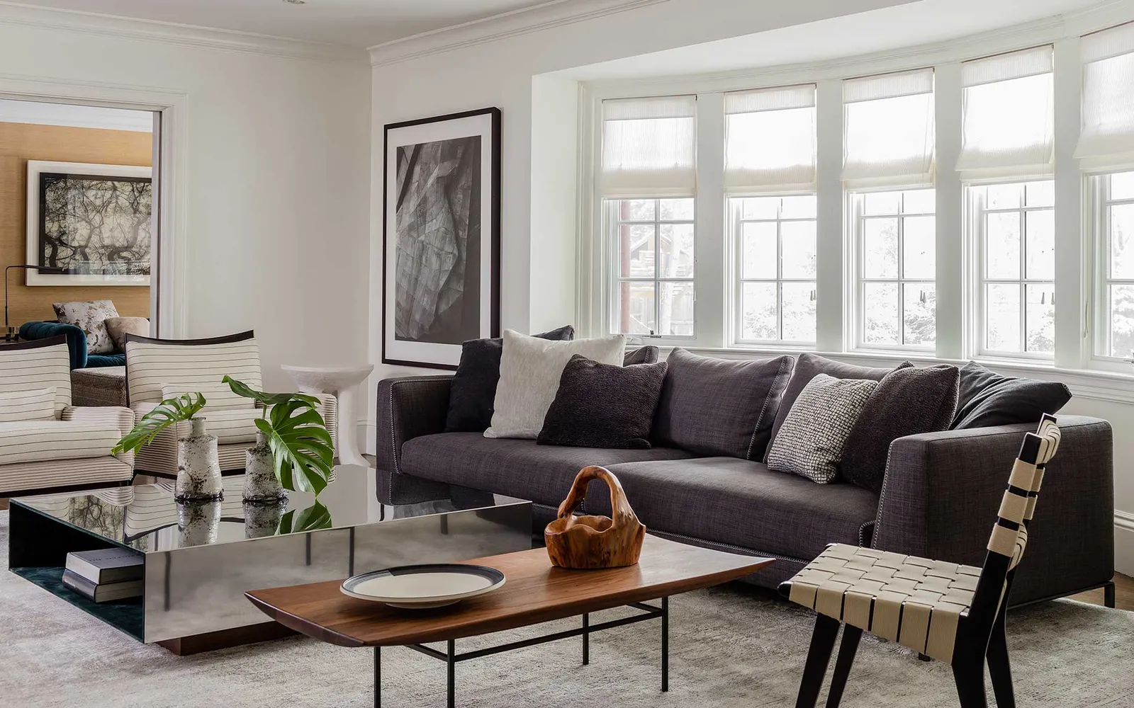 A living room filled with furniture and a large window