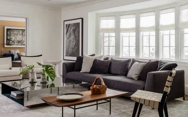 A living room filled with furniture and a large window