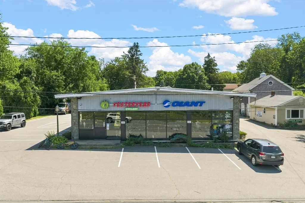 This is the first time this property has been offered for sale. Yesteryear Cyclery has been a staple at this site since 1974. The main retail building features 3,723 sq. ft. of street-level space and a 3,723 sq. ft. heated lower level. There is an additional office or small retail building providing 616 sq. ft. with a full basement. The property also includes a charming residential barn from 1840, which features a renovated one-bedroom apartment with a rear deck, as well as a barn offering versatile storage, garage, and workspace. This is a rare opportunity to acquire a highly visible location in an area where the city is planning a new office/industrial park at the nearby Whaling City Golf Club. The property benefits from exceptional exposure, with approximately 20,000 + cars passing by daily at the interchange.