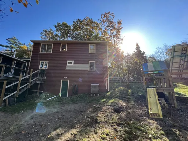Rear elevation before the addition, looking across the back yard