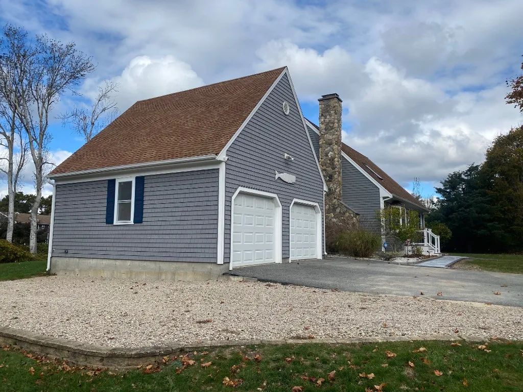 Front exterior with driveway and attached garage