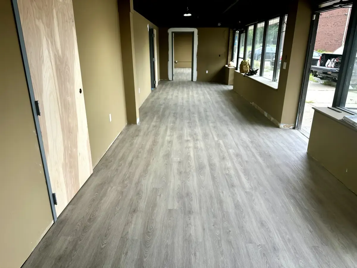 Modern vinyl plank flooring installation commercial space