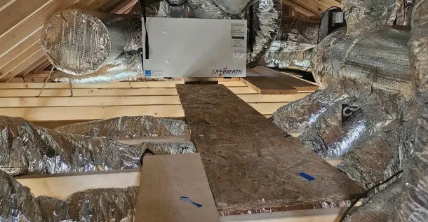 LifeBreath ventilation unit connected to insulated attic ductwork