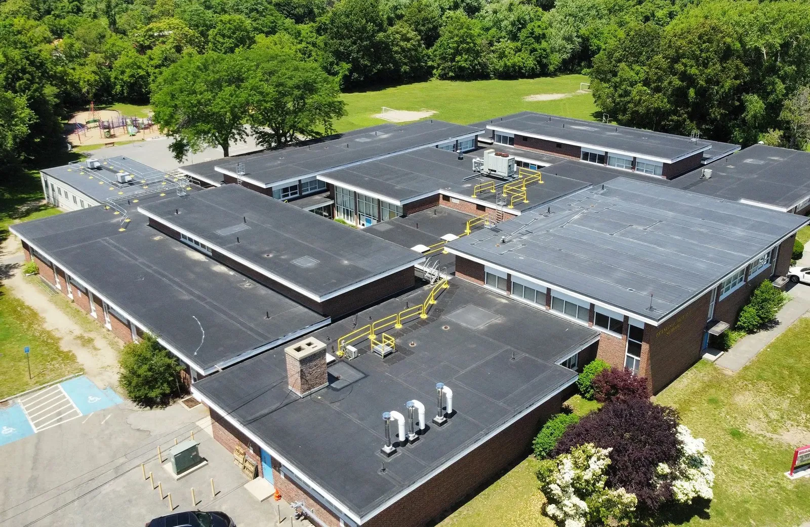 Aerial view of a completed low-slope commercial roof