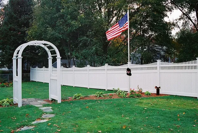 White vinyl fence with arbor gate