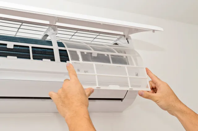 Changing the filter of the air conditioner. Changing filter in air conditioning.