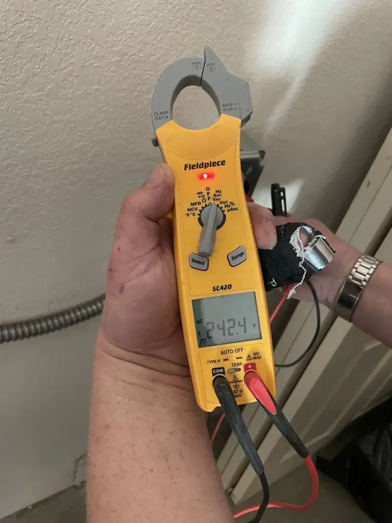 Voltage testing with clamp meter during Electrical Installation Services in Somerville